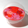 Mondo di rose rosso 2009 - lato 1 - diametro 40cm, olio su plexiglass trattato con resine, acrilico e smalti | Gianna Moise